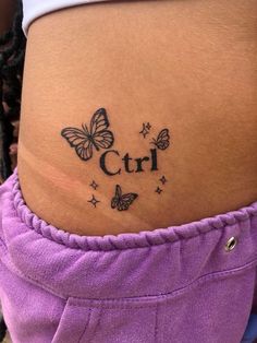 a woman's stomach with butterflies and the word girl written on her side belly