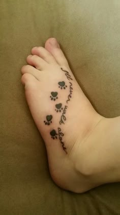 a person has a tattoo on their foot