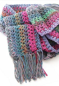 a multicolored knitted scarf with fringes