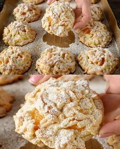 a person picking up some food from a baking pan with powdered sugar on it