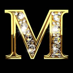 the letter m is made up of gold and diamonds