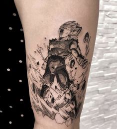 a black and white tattoo on the leg of a person with a bear in it