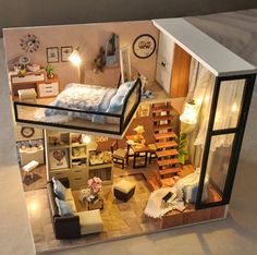 a doll house with furniture and lights inside