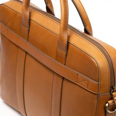 Elevate your professional look with our Shiny Classic Eco-Leather Work Bag, your perfect partner for a seamless transition from boardroom to after-hours. Backed by a lifetime warranty and trade-back options. Luxury Smooth Grain Leather Laptop Bag For Business, Luxury Business Laptop Bag With Smooth Grain Leather, Timeless Satchel For Business Trips With Top Carry Handle, Modern Cognac Bags For Business Trips, Timeless Cognac Bag For Business Trips, Timeless Rectangular Business Shoulder Bag, Luxury Cognac Laptop Bag For Office, Professional Leather Satchel For Everyday Use, Professional Rectangular Briefcase With Smooth Grain