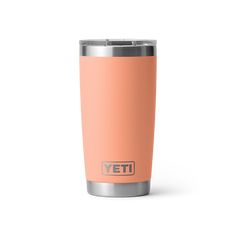 the yeti tumbler is shown in an orange color and has a stainless steel lid