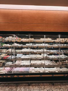 a display case in a store filled with lots of food