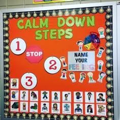 an orange bulletin board with stickers on it that says calm down steps and stop