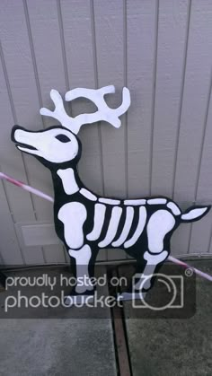 a paper cut out of a skeleton dog