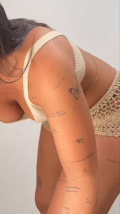 an image of a woman with tattoos on her back