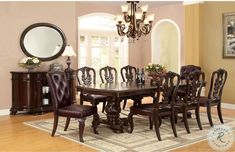 a dining room table with chairs and a chandelier