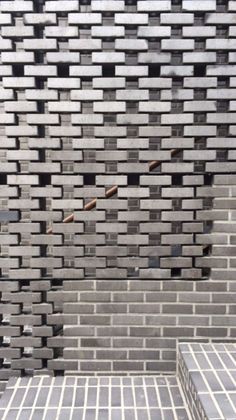 the wall is made out of bricks and cement