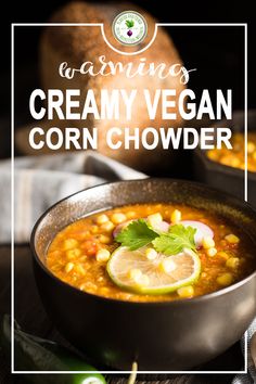 a bowl of creamy vegan corn chowder with lime and cilantro on the side