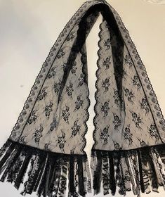 **Long black lace Scarf **THIS BEAUTIFUL  SCARF IS HANDMADE BY ME "Mary Anne Lagana". It is made of excellent quality black lace that flows nicely.  The scarf is fringed with various lace trims.  It measures 84" long  and is 13" wide. Hand wash, line dry.  Great with jackets, tee shirts or dressing up or down....                       SEE MY OTHER SCARVESANIMAL PRINTS, EMBROIDERED, CHIFFON, tropical prints, stripes, FLORALS, HOUNDSTOOTH CHECKS, Dots, abstracts, CRINKLE CHECKS Tropical Prints, Beautiful Scarf, Embroidered Chiffon, Lace Scarf, Lace Trims, Long Black, Tropical Print, Scarf Wrap, Black Lace