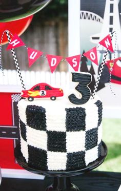 a black and white cake sitting on top of a table