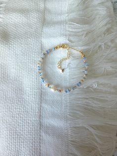 FOR OTHER DAINTY BEADED BRACELETS: https://www.etsy.com/ca/shop/ArtiChouXCanada?ref=seller-platform-mcnav§ion_id=46088511 Bracelet Length: 13-18cm (5.1-7 inches) with a 14k gold filled extender. But if you require a different size or prefer a personalized touch, please don't hesitate to get in touch. This bracelet features an assortment of summer themed pastel colors: blue, white , orange, cream, and 18k gold filled seed beads. It also contains a freshwater pearl.  Thread may be visible since it is a handmade product   SIZING  Wrap a soft measuring tape snugly around the widest part of your wrist. Add 1.27cm (0.5in) to that measurement to determine the right bracelet size.  MATERIALS  - Japanese MGB glass seed beads(2x4mm) - 18K gold filled beads of 2mm - Freshwater pearl - 14K gold filled Classy Bracelets, Beaded Bracelet Diy, Adjustable Beaded Bracelet, Beaded Ankle Bracelets, Diy Jewelry Inspiration, Seed Bead Bracelet, Beads Bracelet Design, Beaded Jewelry Designs, Bracelet Dainty