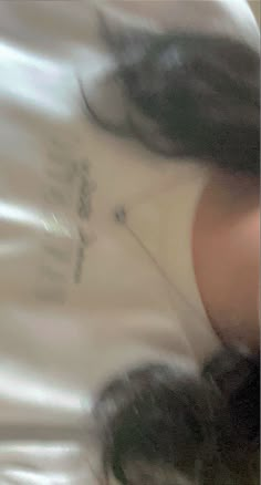 a blurry photo of a woman laying down