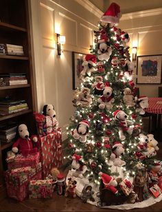 a christmas tree decorated with teddy bears and presents