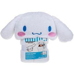 a white stuffed animal with blue eyes and pink ears on it's head, in front of a white background