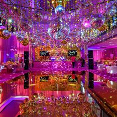 a room filled with lots of purple and gold decorations