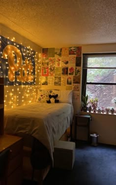 a bedroom decorated with lights and pictures on the wall