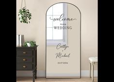 an arch shaped mirror with the words welcome you to our wedding written in cursive font