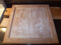 an unfinished cabinet door sitting on top of a counter