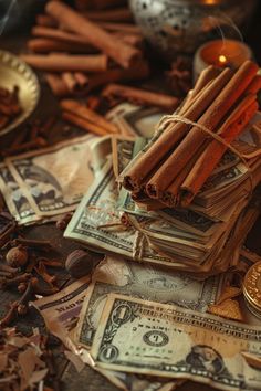 some cinnamon sticks are sitting on top of money