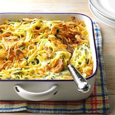 a casserole dish filled with pasta and meat