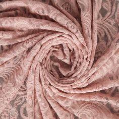 an image of a pink lace fabric