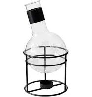 an empty glass bottle sitting on top of a metal stand with a wire holder underneath it