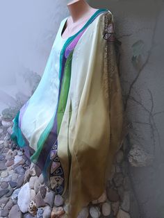 "Silk Tunic Hand Painted, Abstract Batik Top, Christmas Gift for Women. Lightweight transparent handmade silk tunic, convenient for summer, not hot, a great gift for women, one size fits all. This chic silk caftan \"boho\" will be ready to be shipped in a few days. It is an excellent accessory for day trips. Ideal for holidays, special occasions, on the beach or any other place where you want to experience bohemian luxury. The luxurious tunic of fine natural silk creates a magnificent smooth dra Bohemian Multicolor Dupatta For Spring, Multicolor Shawl Dupatta For Summer, Multicolor Summer Shawl Dupatta, Summer Multicolor Shawl-style Dupatta, Summer Multicolor Shawl Dupatta, Green Silk Tunic Kaftan, Traditional Silk Scarf For Summer, Bohemian Silk Scarf For Summer, Bohemian Silk Dupatta For Festival