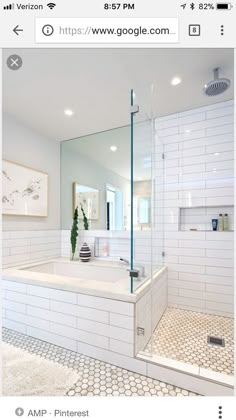 a large bathroom with a walk in shower next to a bathtub