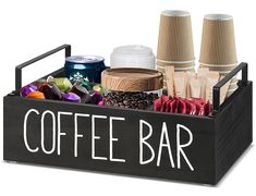 a coffee bar tray with two cups and various types of items in it on a white background