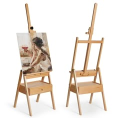 two wooden easels with paintings on them