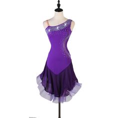 a purple dress with sequins on the top and bottom, sitting on a mannequin