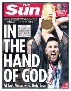 a man holding up a trophy on top of a magazine cover with the words in the hand of god