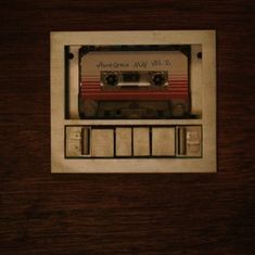 an old fashioned radio sitting on top of a wooden table