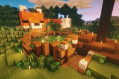 an image of a minecraft house in the middle of some trees and bushes with candles on it