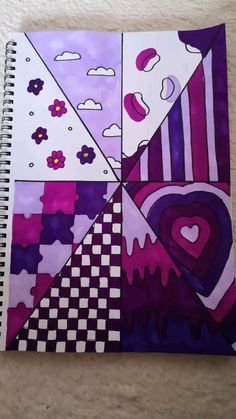 a spiral notebook with an abstract design on the front and back cover, in purple tones