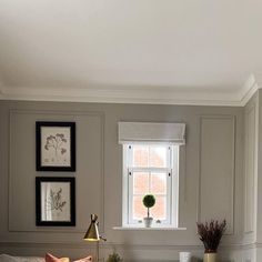 a living room filled with furniture next to a window