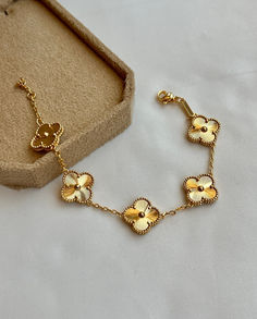 Discover the charm of this Four Leaf Clover Bracelet, designed to bring good luck and elegance to your look. Luxury Gold Flower Bracelet, Elegant Gold-plated Flower-shaped Bracelet, Elegant Gold Plated Flower-shaped Bracelet, Classic Gold Jewelry In Flower Shape, Dainty Gold Flower Shaped Bracelets, Gold Flower Shaped Bracelets For Formal Occasions, Elegant Gold Bracelets With Flower Shape, Gold Flower-shaped Elegant Bracelets, Gold Flower Shaped Elegant Bracelets