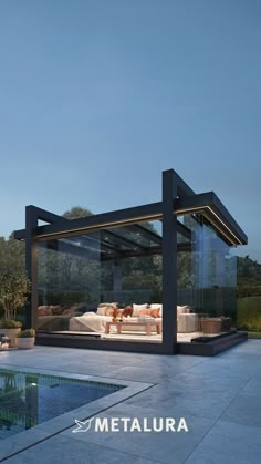 an outdoor living area next to a swimming pool