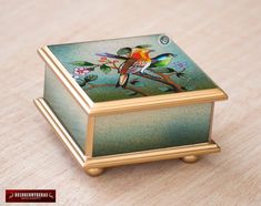 a decorative box sitting on top of a wooden table