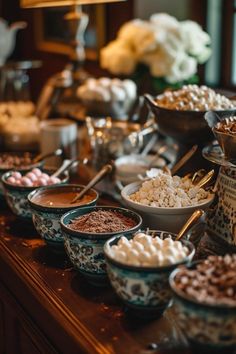 a buffet table filled with lots of different types of foods and desserts on it