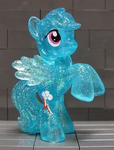 a glass figurine that looks like a little pony