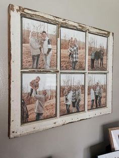 a group of people hanging on the side of a wall next to a framed photo