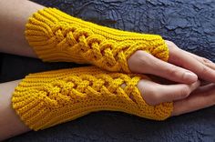 a woman wearing yellow knitted arm warmers