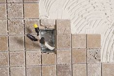 an aerial view of a tiled wall with tools