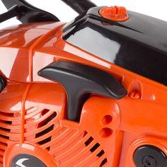 an orange toy lawn mower with black trimming on the front and side wheels