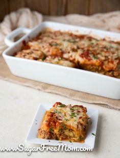 lasagna casserole with meat and cheese in a white dish on a table